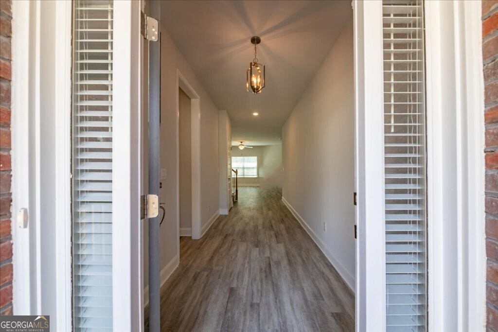 361 Eagle Ridge Road Macon, GA 31216 - Photo 4 of 50 a view of a hallway with wooden floor and staircase