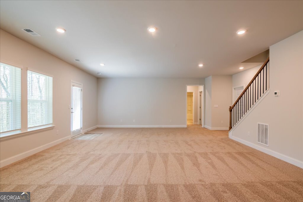 361 Eagle Ridge Road Macon, GA 31216 - Photo 45 of 50 a view of an empty room with wooden floor and a window