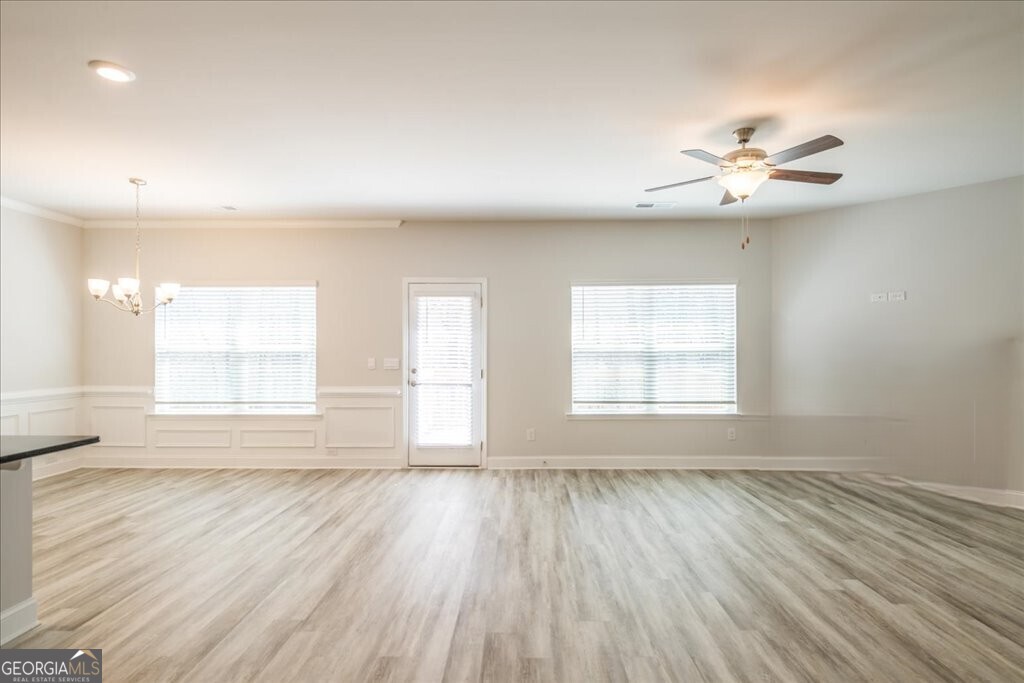 361 Eagle Ridge Road Macon, GA 31216 - Photo 10 of 50 wooden floor in an empty room with a window