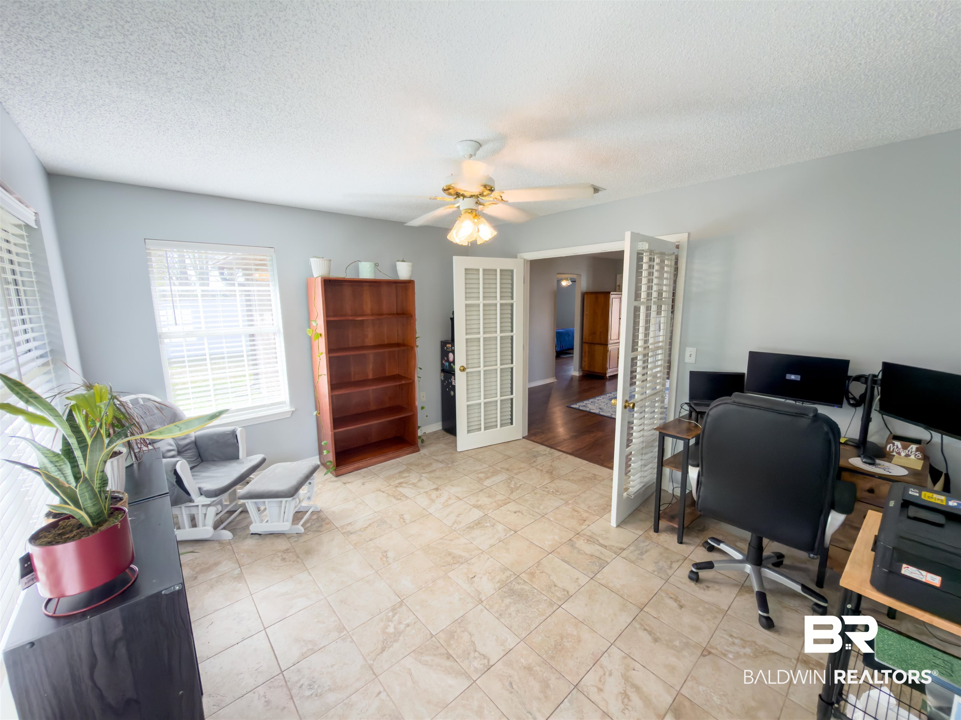 129 Pennbrooke Loop Foley, AL 36535 - Photo 7 of 44 Office featuring a textured ceiling, ceiling fan, and french doors