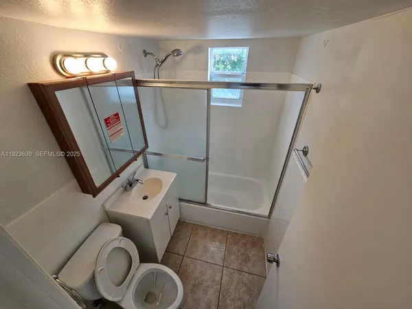 a bathroom with a toilet and a sink