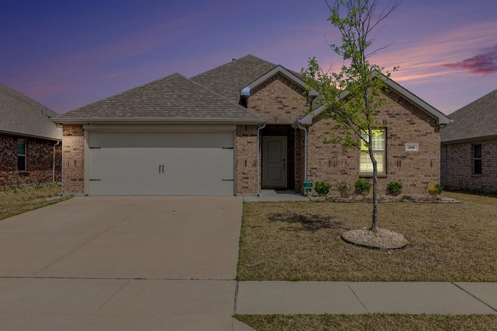 706 Spur Ridge Princeton, TX 75407 - Photo 1 of 38 a front view of a house with garden