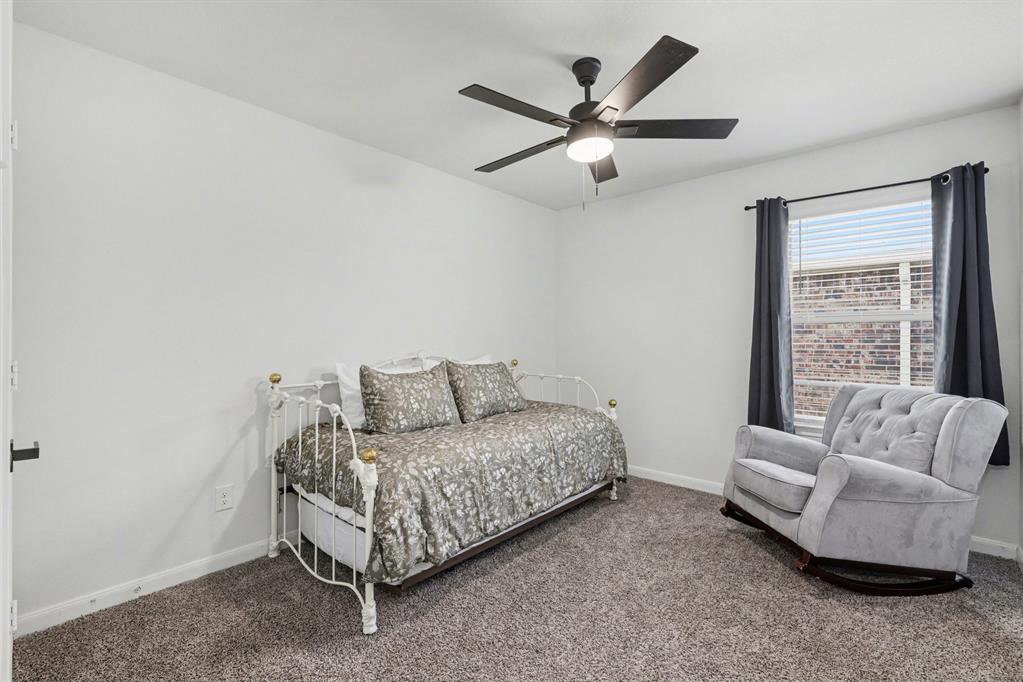 706 Spur Ridge Princeton, TX 75407 - Photo 27 of 38 a living room with furniture and a large window