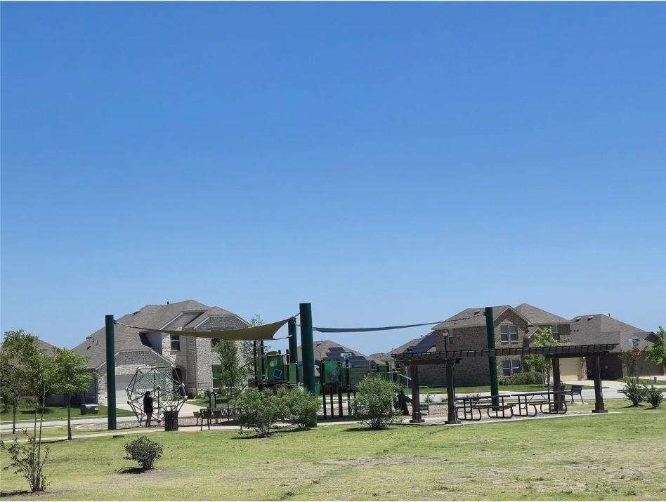 706 Spur Ridge Princeton, TX 75407 - Photo 34 of 38 a front view of a house with a yard