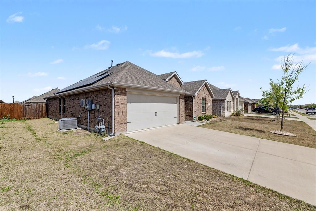 706 Spur Ridge Princeton, TX 75407 - Photo 6 of 38 a front view of a house with a yard and garage