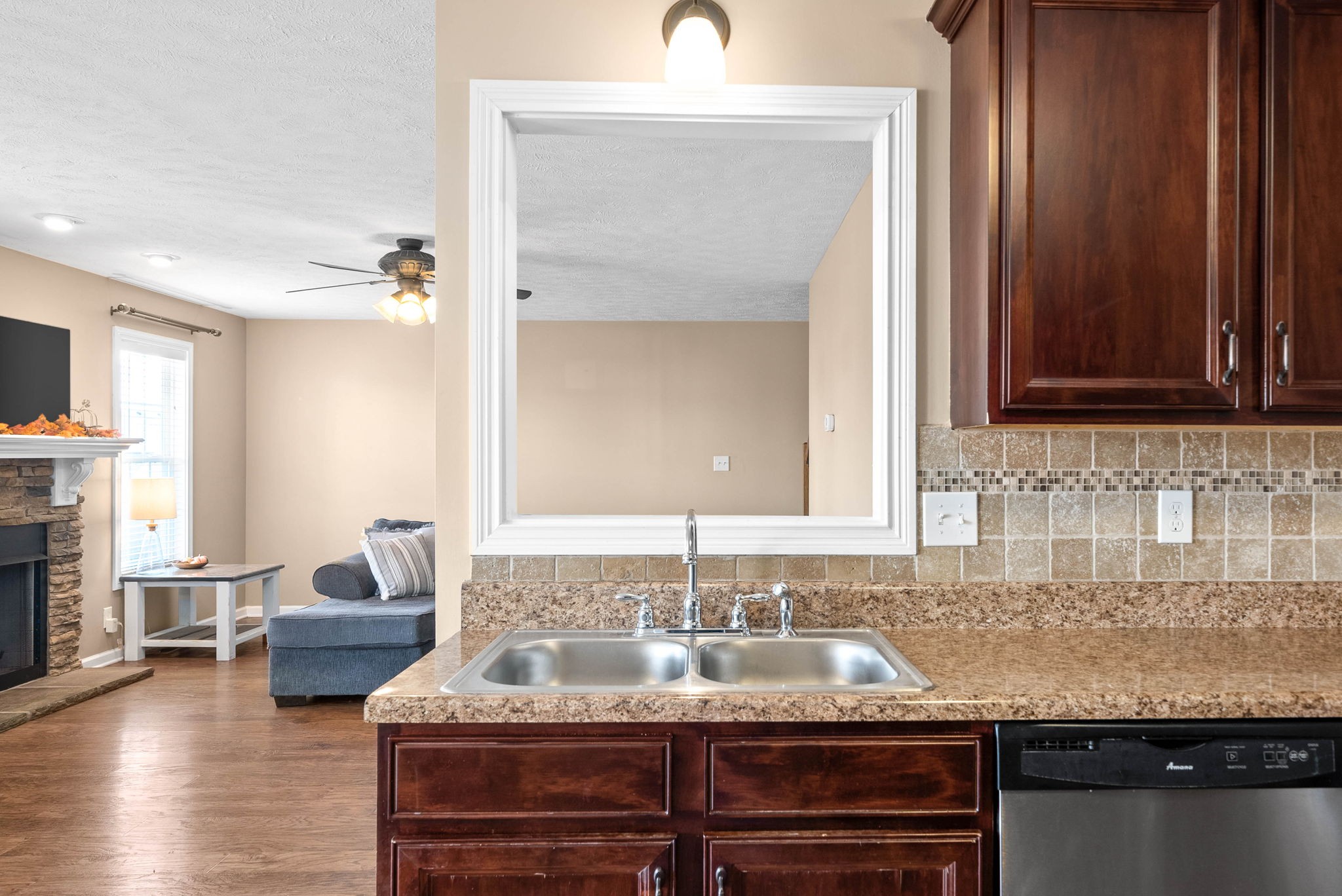 3771 Suiter Road Clarksville, TN 37040 - Photo 13 of 28 a view of a kitchen with granite countertop a sink dishwasher stove and cabinets