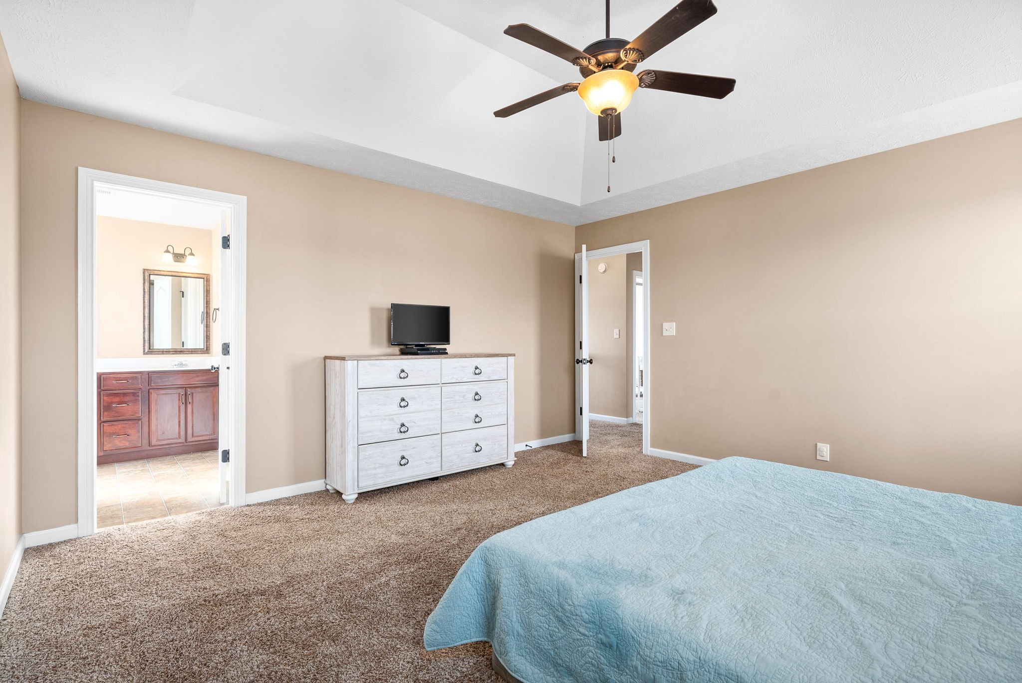 3771 Suiter Road Clarksville, TN 37040 - Photo 18 of 28 a bedroom with a bed and a chandelier