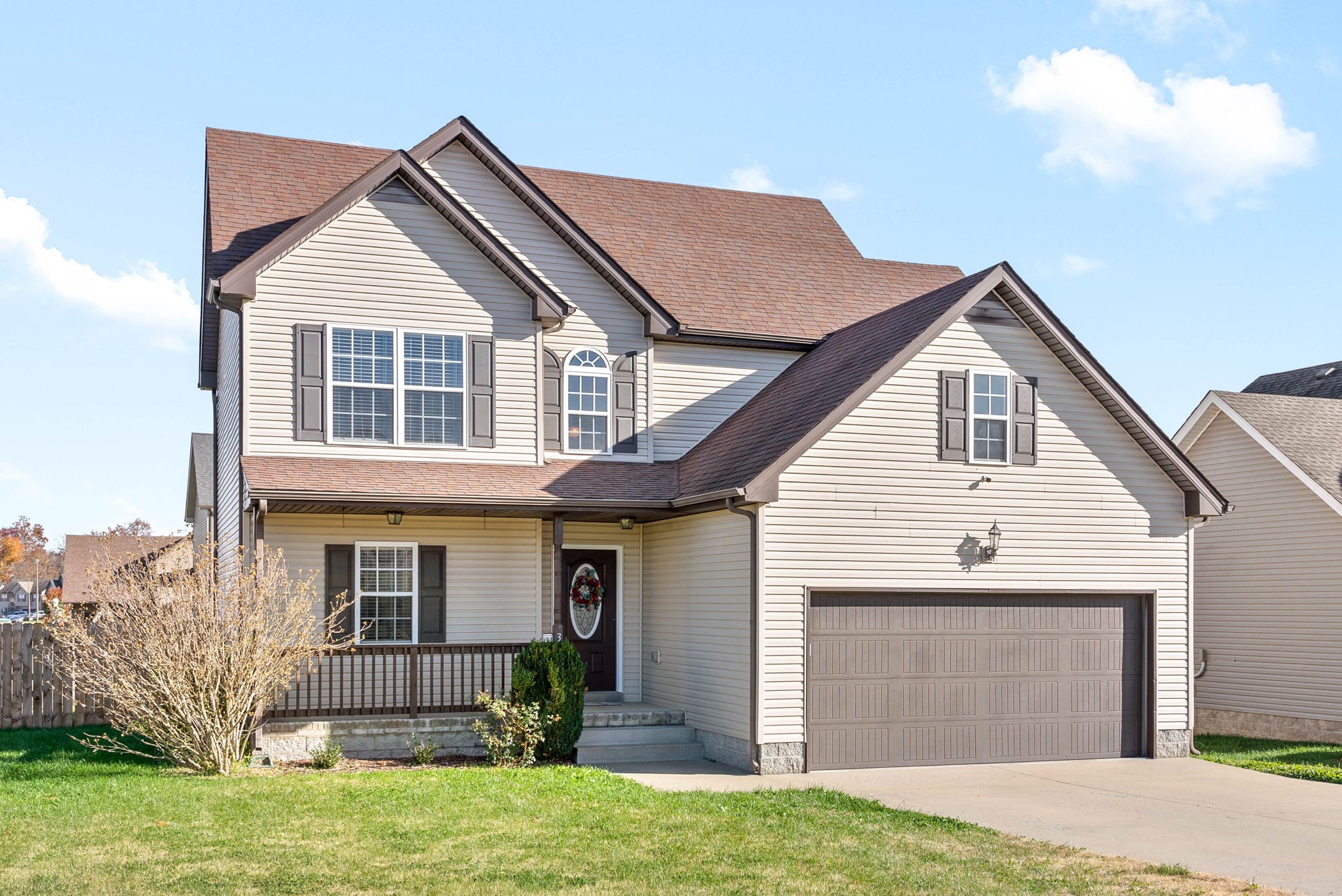 3771 Suiter Road Clarksville, TN 37040 - Photo 2 of 28 a front view of a house with a yard and garage
