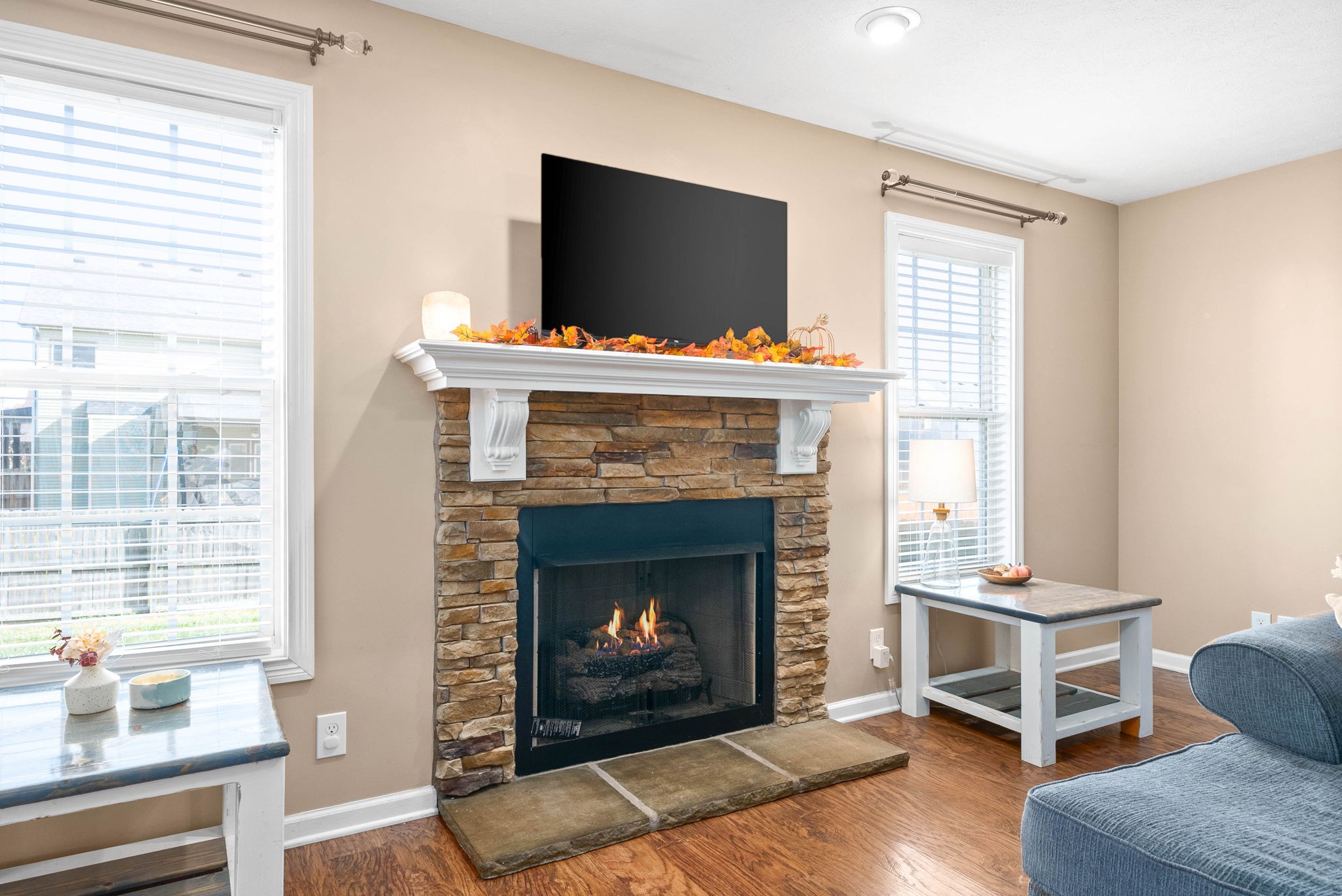 3771 Suiter Road Clarksville, TN 37040 - Photo 8 of 28 a living room with furniture a flat screen tv and a fireplace