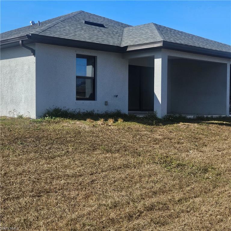 131 Gilbert Avenue South Lehigh Acres, FL 33973 - Photo 13 of 13 a view of front of a house