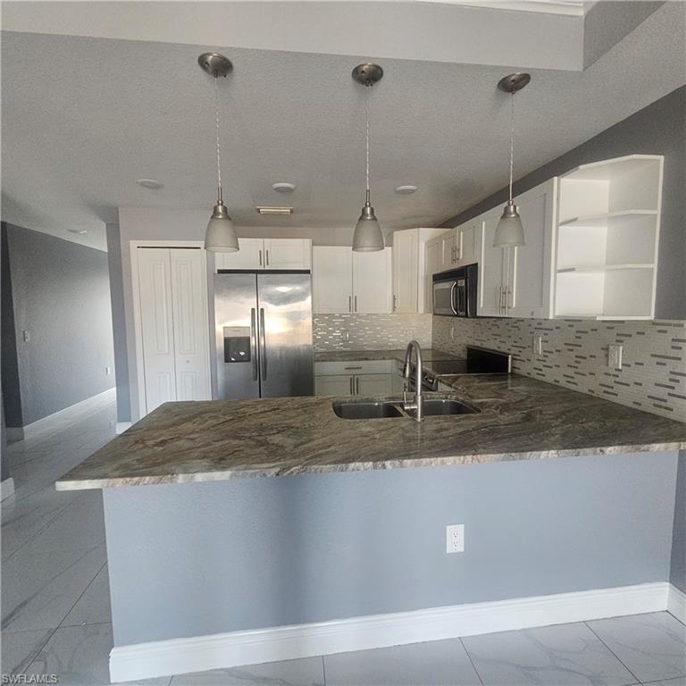 131 Gilbert Avenue South Lehigh Acres, FL 33973 - Photo 7 of 13 a view of a kitchen counter space