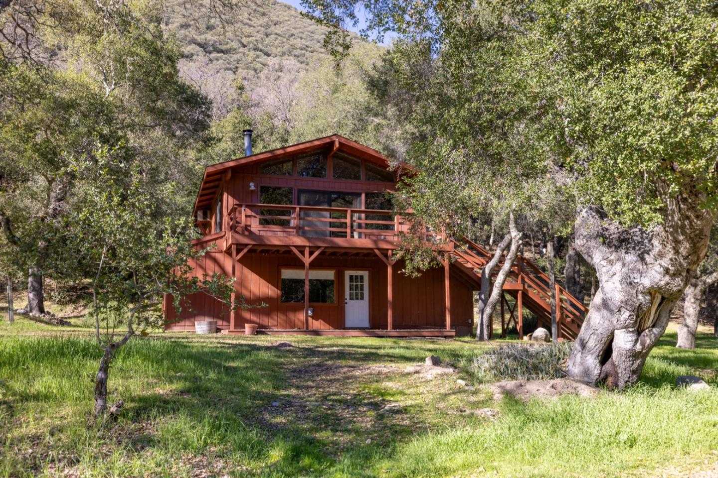 42250 East Carmel Valley Road Greenfield, CA 93927 - Photo 1 of 50 a view of a wooden house with a yard