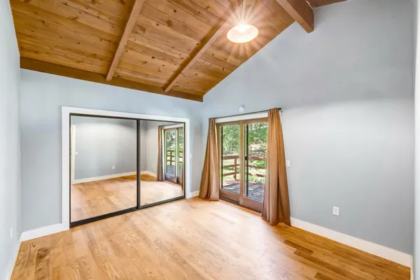 a view of an empty room with a balcony