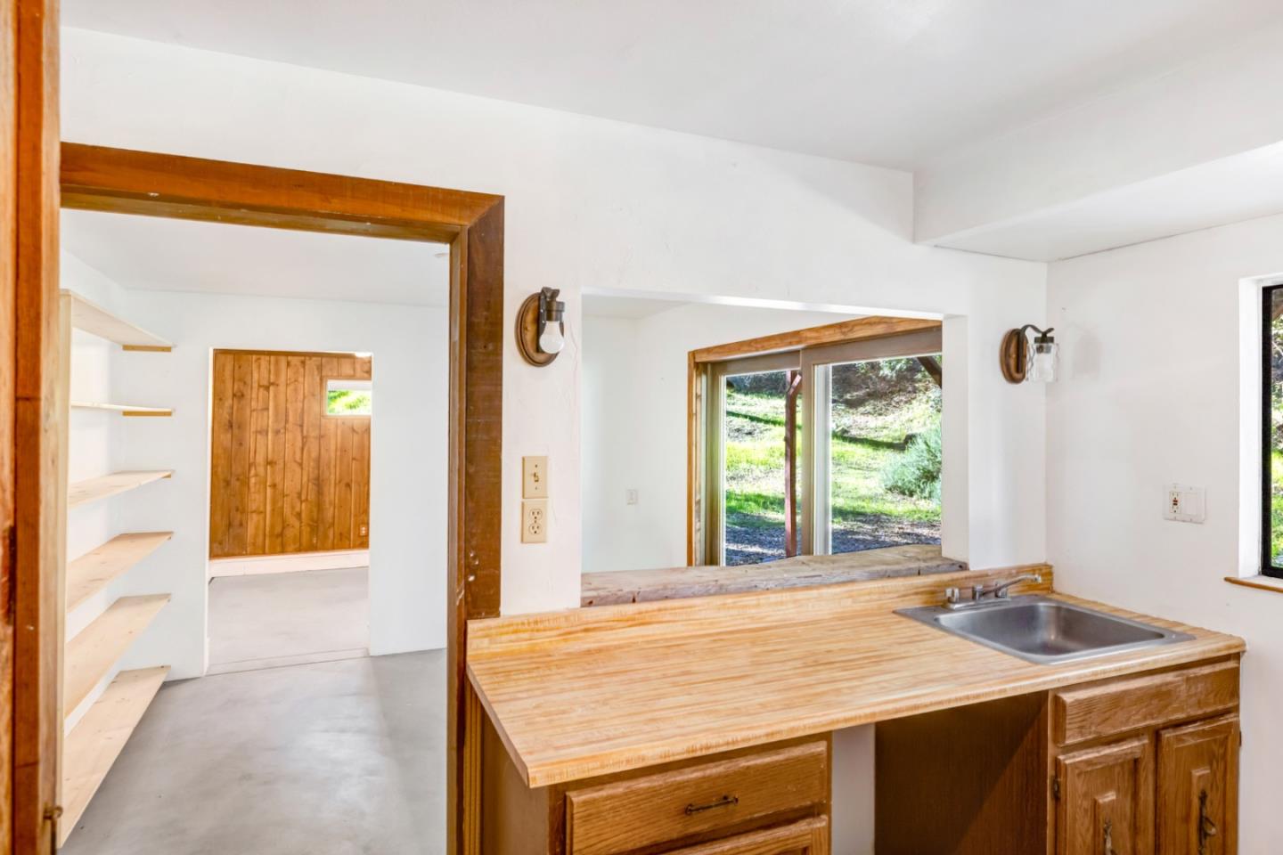 42250 East Carmel Valley Road Greenfield, CA 93927 - Photo 19 of 50 a view of a kitchen with a sink and a large window