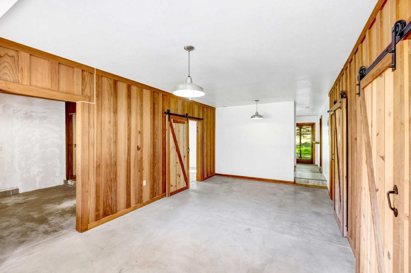 42250 East Carmel Valley Road Greenfield, CA 93927 - Photo 20 of 50 a view of a hallway with wooden walls