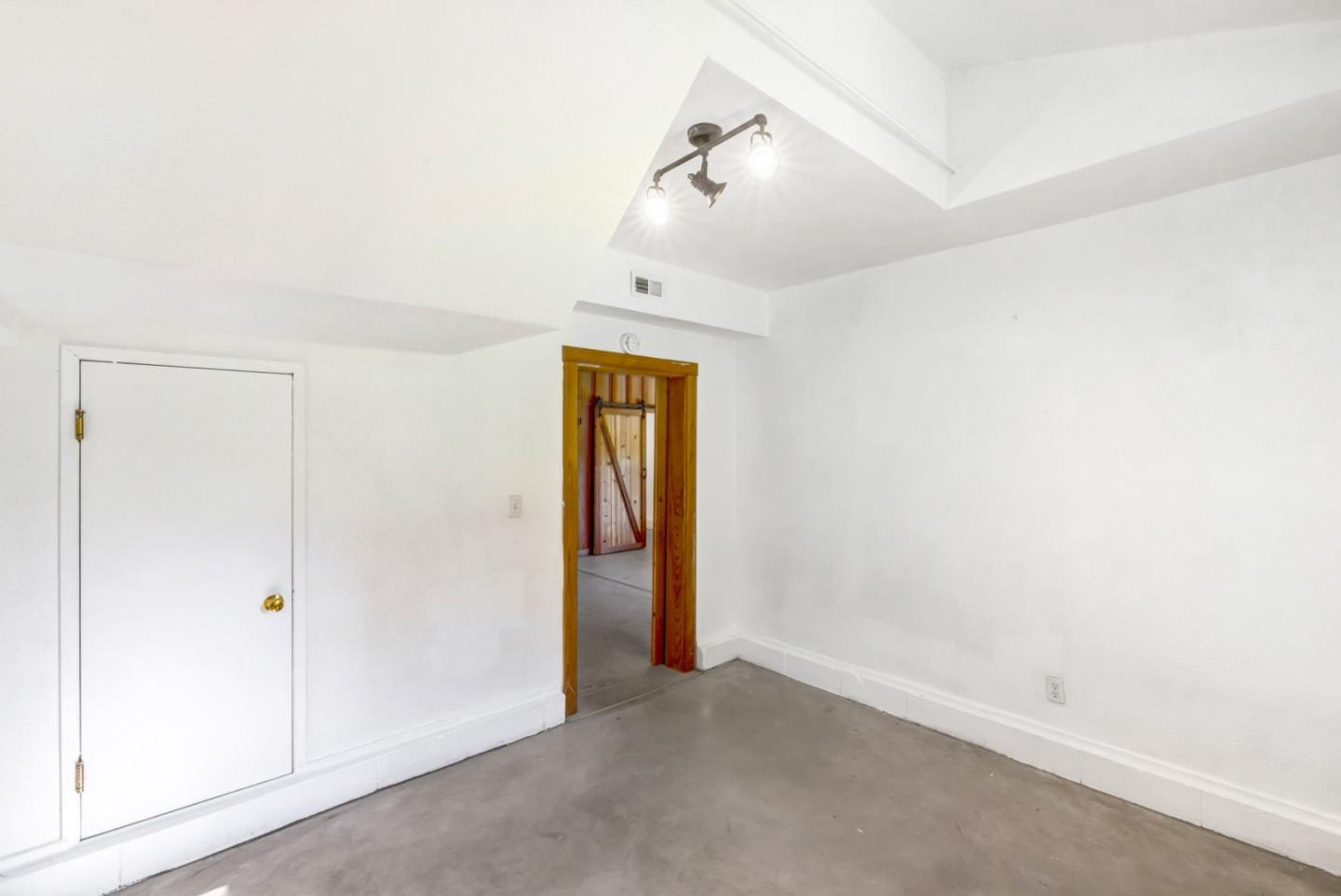 42250 East Carmel Valley Road Greenfield, CA 93927 - Photo 25 of 50 an empty room with a ceiling fan and a window