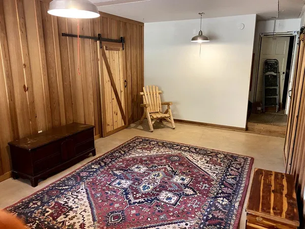 wooden floor with a rug