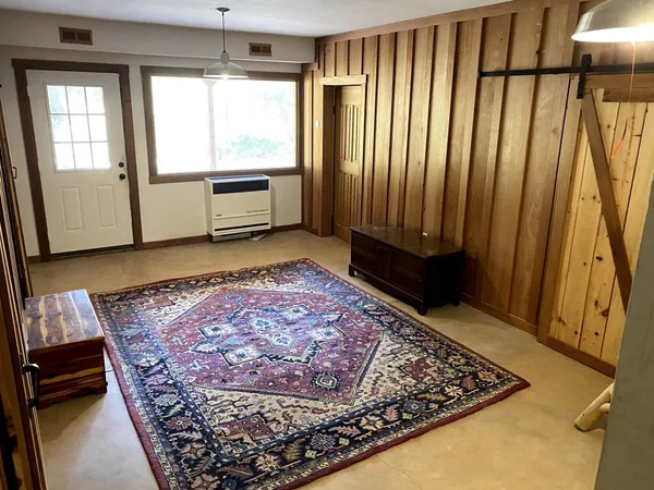 a view of a room with a window and a shower
