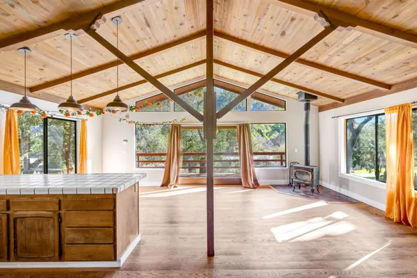a view of an entryway with a floor to ceiling windows