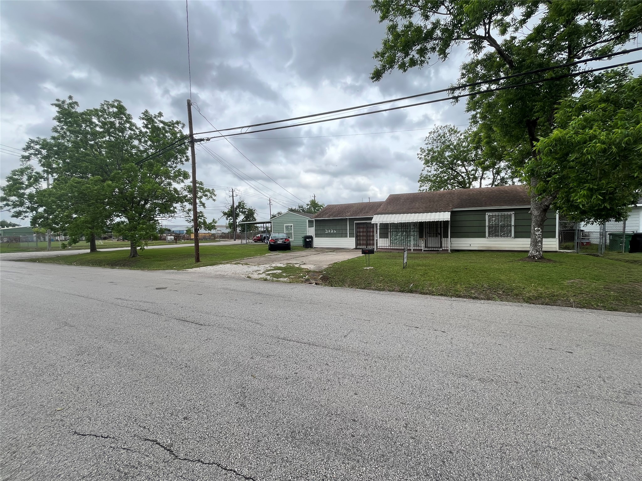 2836 Cochran Street Houston, TX 77009 - Photo 2 of 17 a view of a house with a big yard and large trees