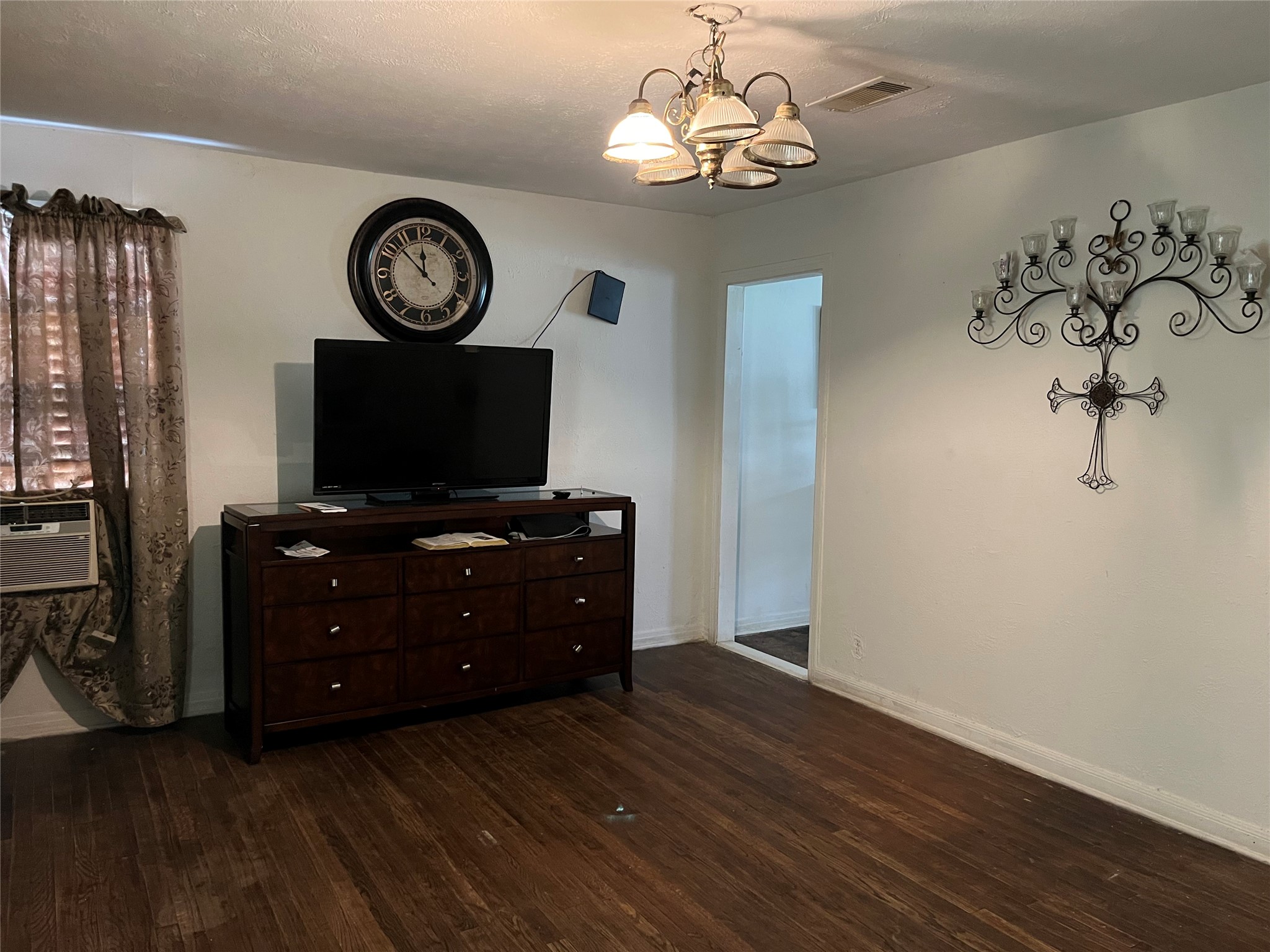 2836 Cochran Street Houston, TX 77009 - Photo 3 of 17 a living room with furniture and a flat screen tv