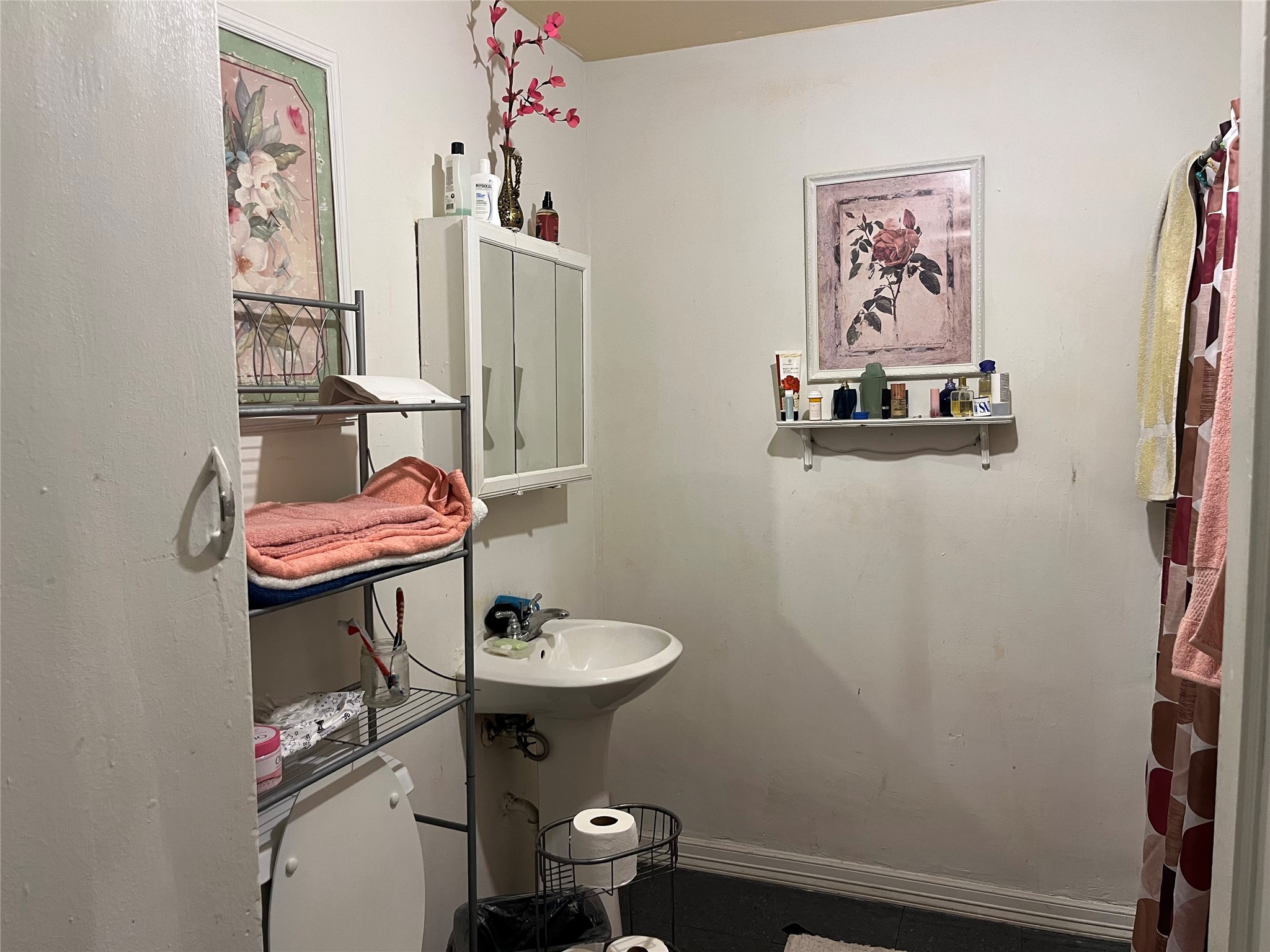 2836 Cochran Street Houston, TX 77009 - Photo 5 of 17 a bathroom with a sink and a mirror