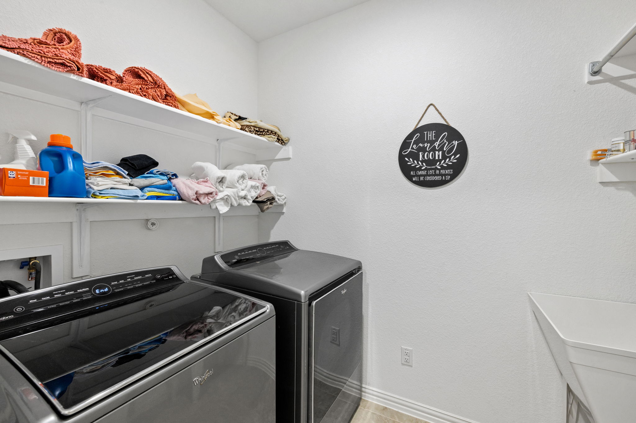 3824 Ashbury Road Round Rock, TX 78681 - Photo 23 of 30 Laundry room with shelving and utility sink (washer & dryer convey)