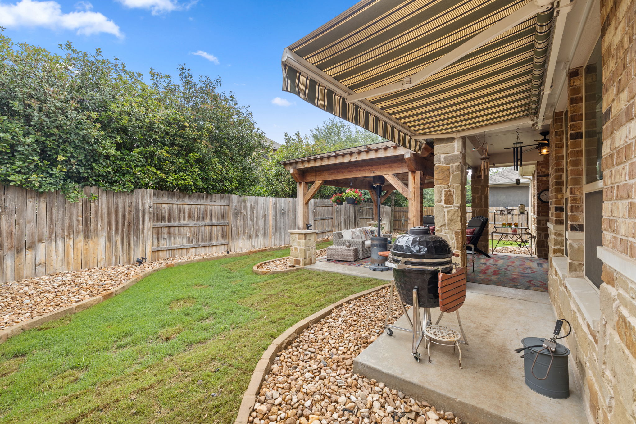 3824 Ashbury Road Round Rock, TX 78681 - Photo 26 of 30 The retractable awning allows you to grill even in the rain!
