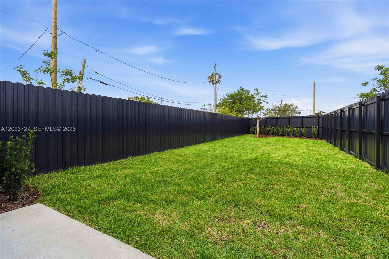 22348 Southwest 115th Court, Unit 22348 Miami, FL 33170 - Photo 35 of 37 a view of a backyard with a garden
