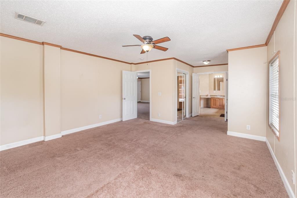 25542 Mathew Street Christmas, FL 32709 - Photo 12 of 18 a view of a livingroom with a ceiling fan and window