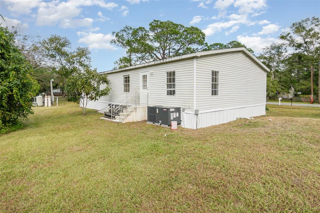 25542 Mathew Street Christmas, FL 32709 - Photo 17 of 18 a view of back yard of the house