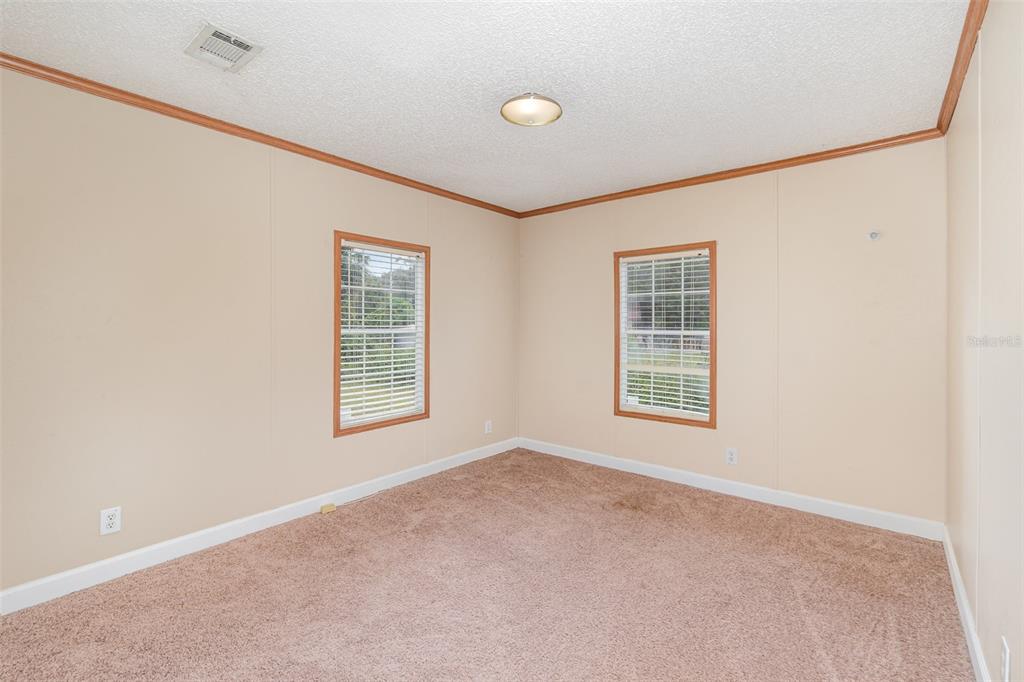 25542 Mathew Street Christmas, FL 32709 - Photo 8 of 18 a view of an empty room with a window