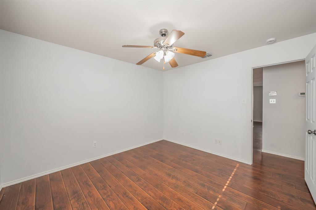 712 Grant Street Burleson, TX 76028 - Photo 20 of 28 a view of an empty room with chandelier fan