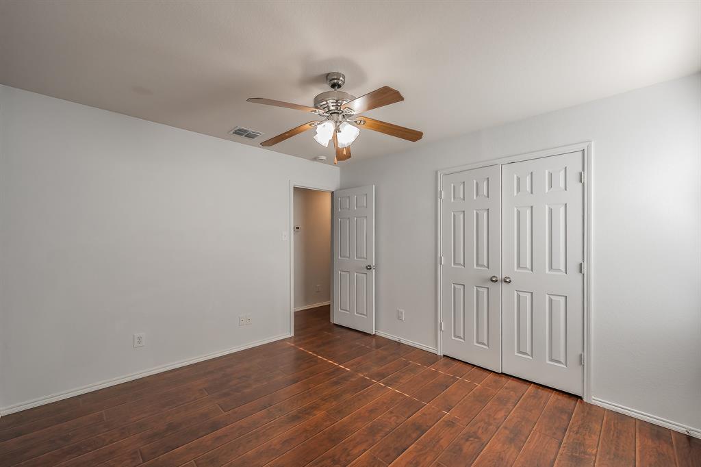 712 Grant Street Burleson, TX 76028 - Photo 21 of 28 a view of an empty room with chandelier fan
