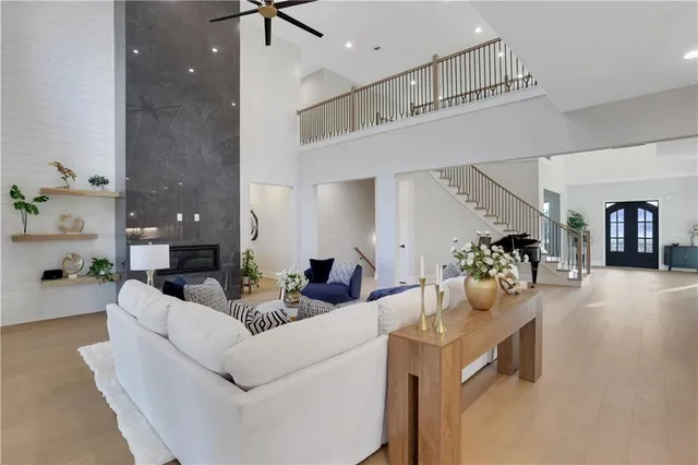 a living room with lots of furniture and kitchen view