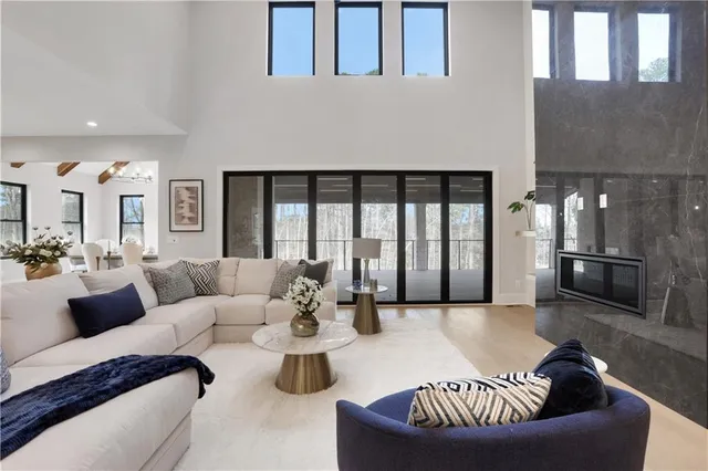 a spacious bedroom with a bed and ceiling fan