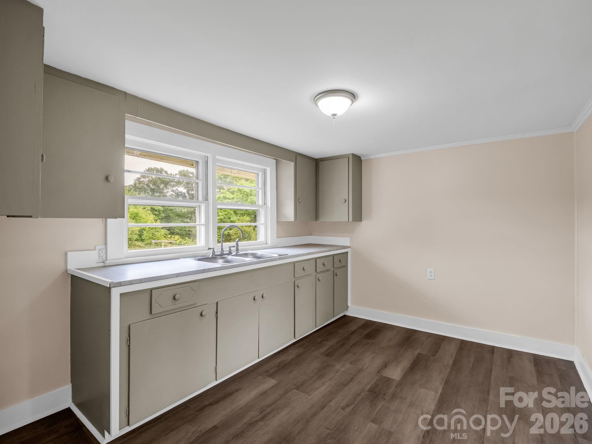 170 Dobbins Road Ellenboro, NC 28040 - Photo 26 of 32 a view of cabinets with wooden floor and sink