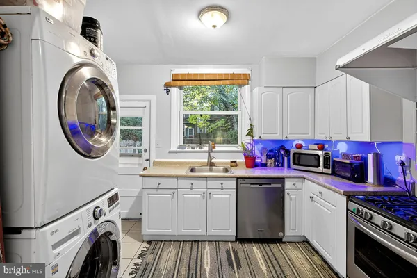 a kitchen that has a stove and a sink