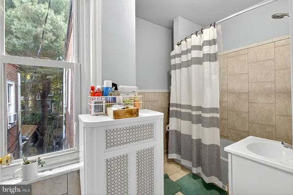 a bathroom with a sink and a shower