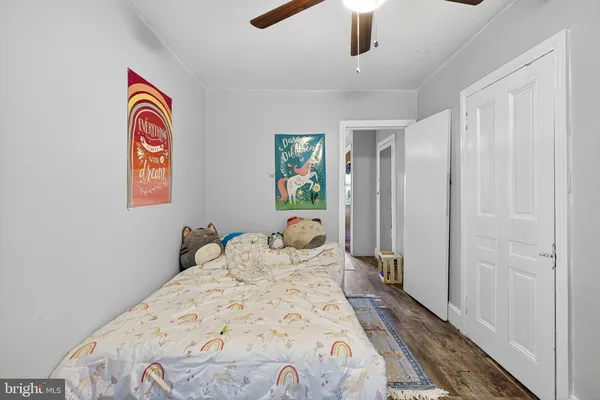 a view of a bedroom with a bed and a chandelier