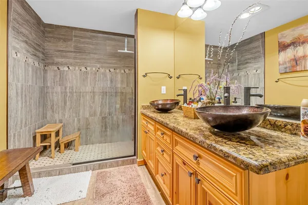 a kitchen with a sink a stove and a wooden cabinets
