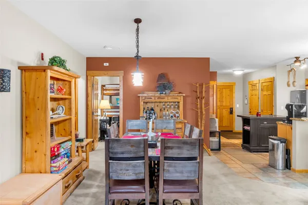 a view of a dining room with furniture window and outside view