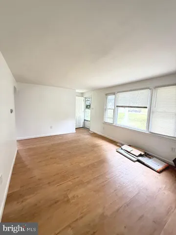 an empty room with windows and view