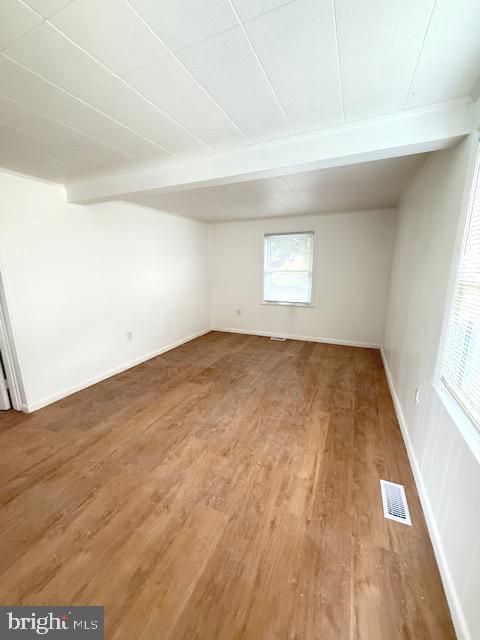 321 Bondsville Road Downingtown, PA 19335 - Photo 15 of 19 an empty room with wooden floor and windows