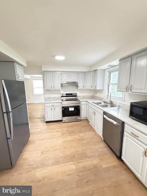 321 Bondsville Road Downingtown, PA 19335 - Photo 6 of 19 a large kitchen with cabinets stainless steel appliances and a window