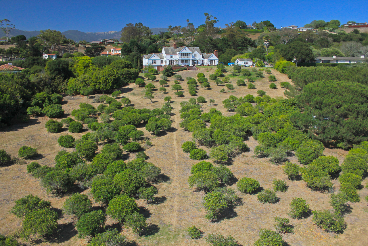 Undisclosed Address Hope Ranch, CA 93110 - Photo 14 of 17 a view of a garden with a building in the background