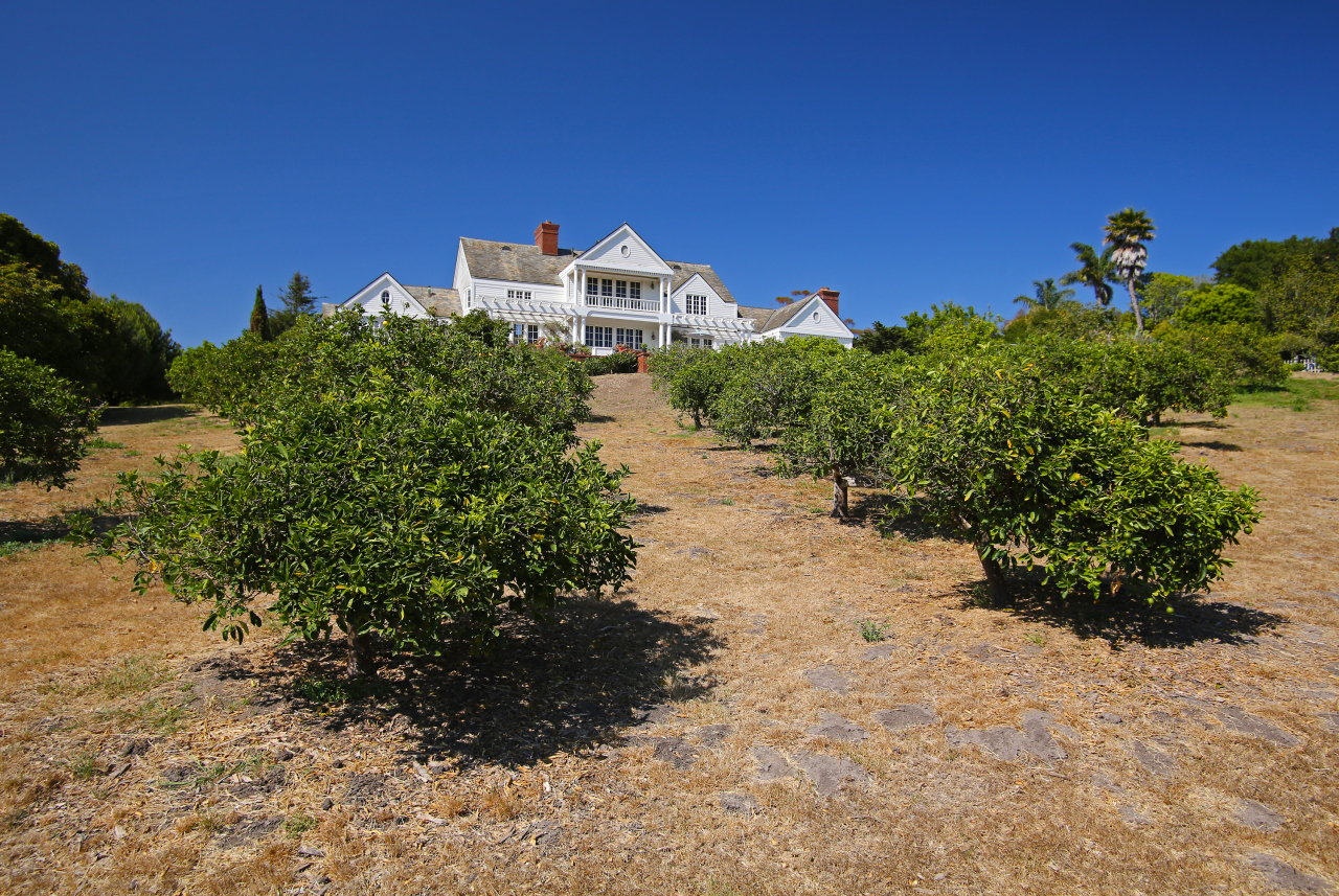 Undisclosed Address Hope Ranch, CA 93110 - Photo 16 of 17 a view of a house with a yard
