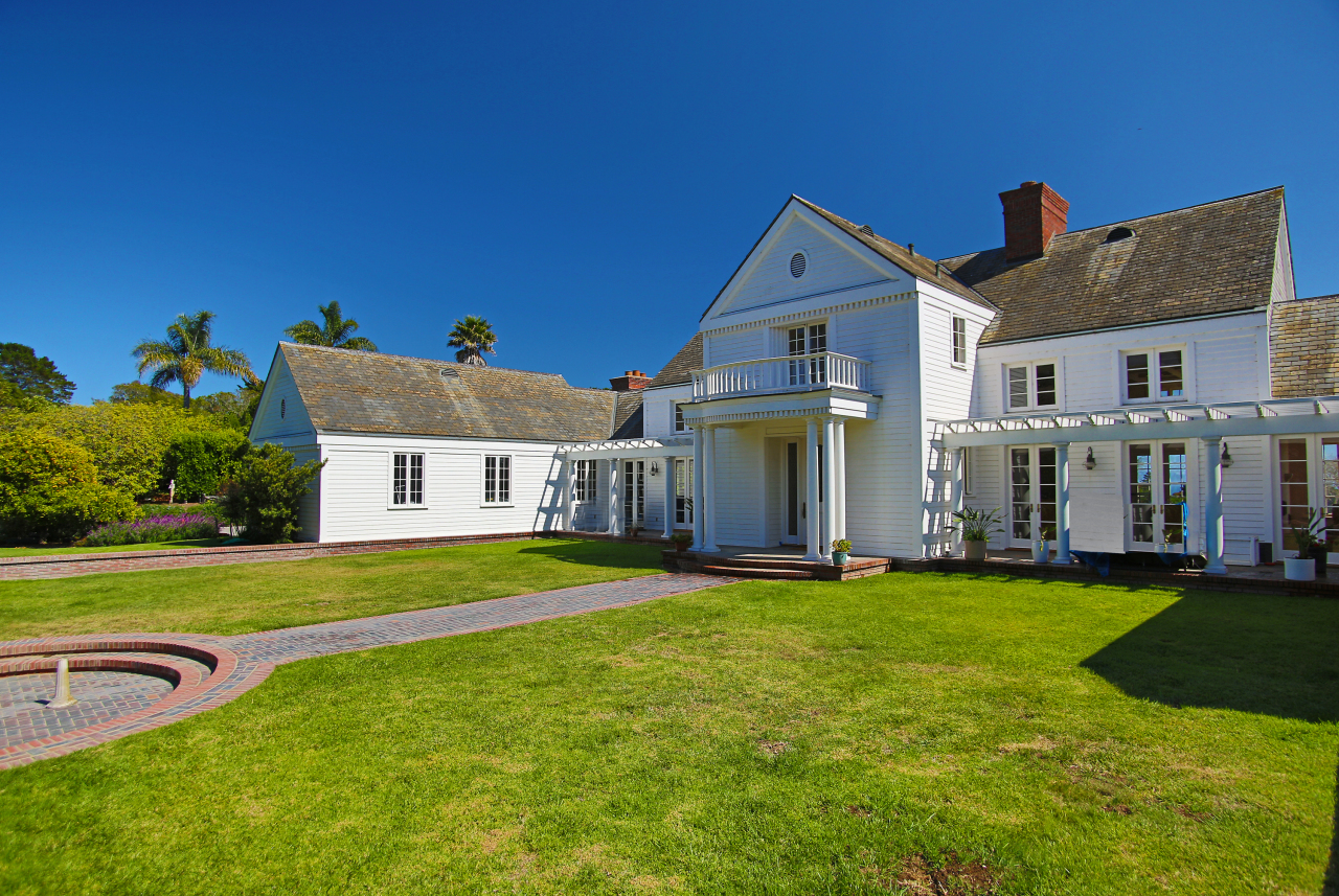 Undisclosed Address Hope Ranch, CA 93110 - Photo 2 of 17 a front view of a house with a yard