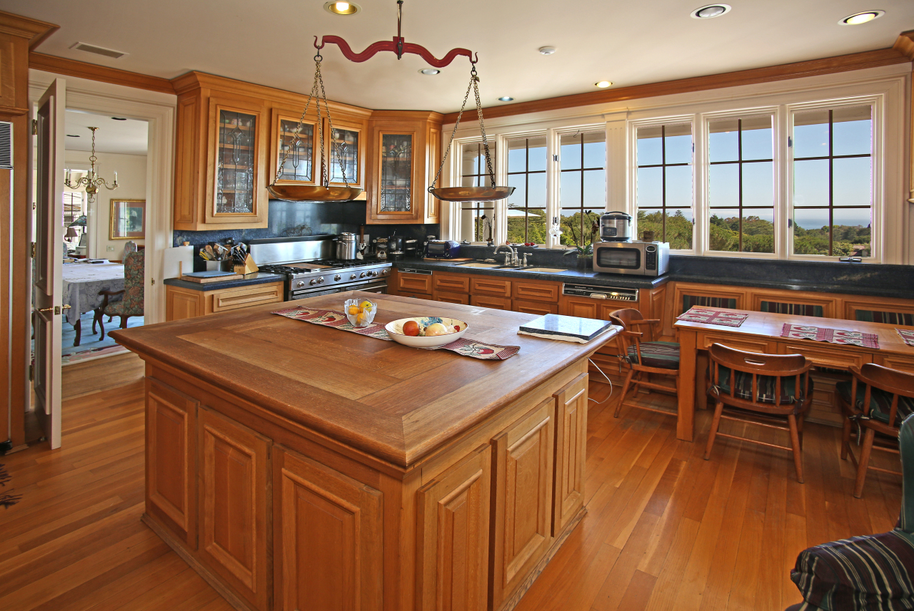 Undisclosed Address Hope Ranch, CA 93110 - Photo 4 of 17 a room with wooden floors table and chairs