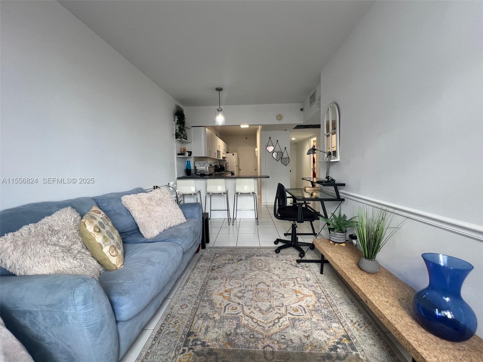 100 Lincoln Road, Unit 1126 Miami Beach, FL 33139 - Photo 10 of 52 a living room with furniture and a couch